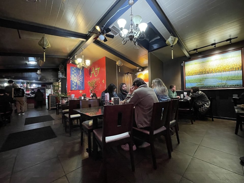 Small plates with tea in a cozy dining room.