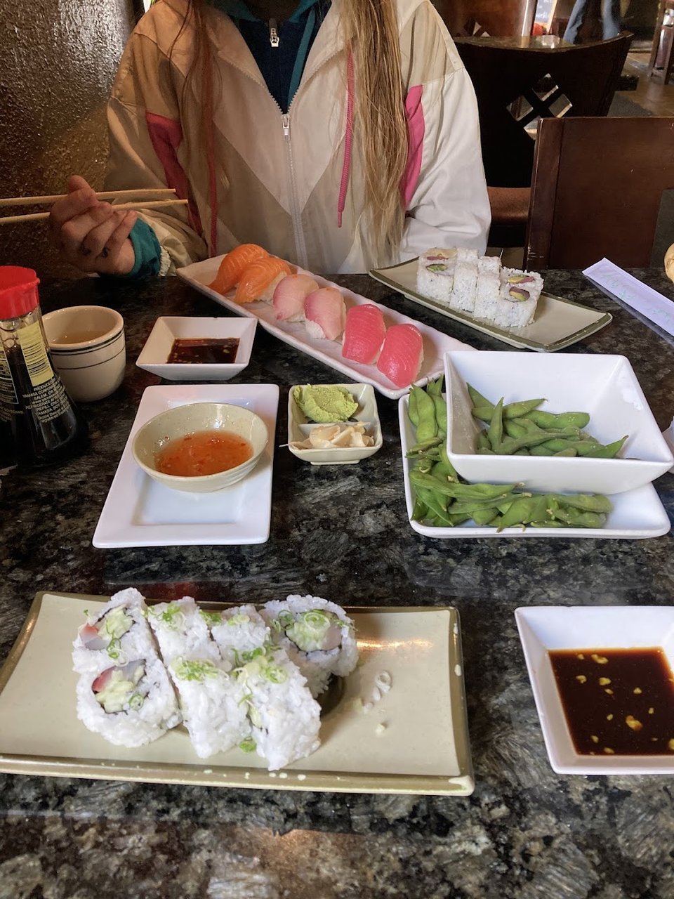 Menu layout showing appetizers, nigiri, and desserts.